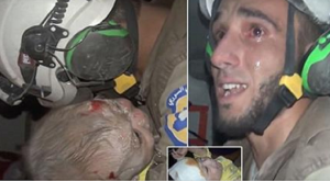 一名敘國救難員自瓦礫堆中救出1名1個月大女嬰，忍不住激動落淚。（圖片來源/翻攝自網路）